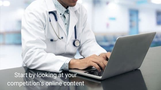 A doctor searching online on a laptop