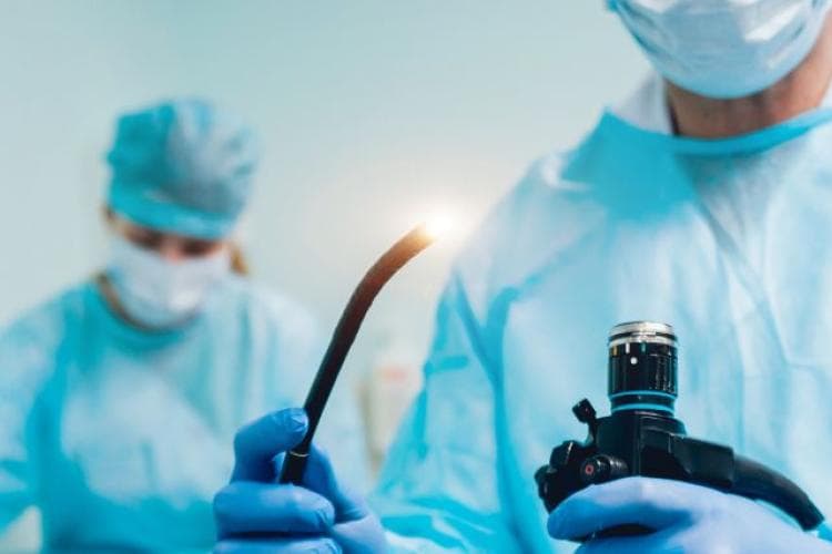 Surgeon with endoscopy scope.