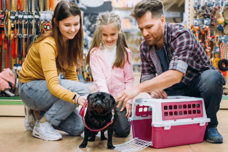 Family shopping for pet supplies with pug