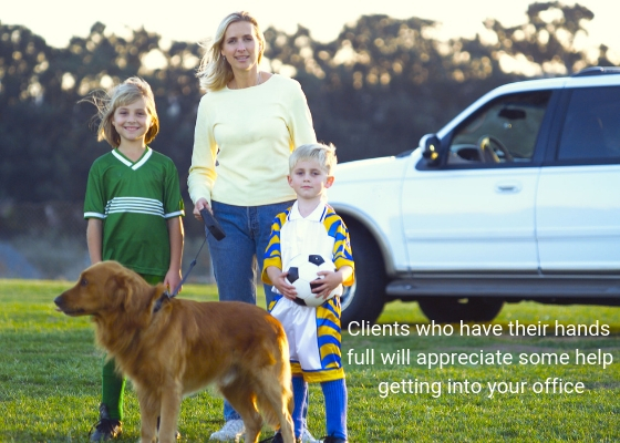 Photo of a busy mom with her two kids and the family dog